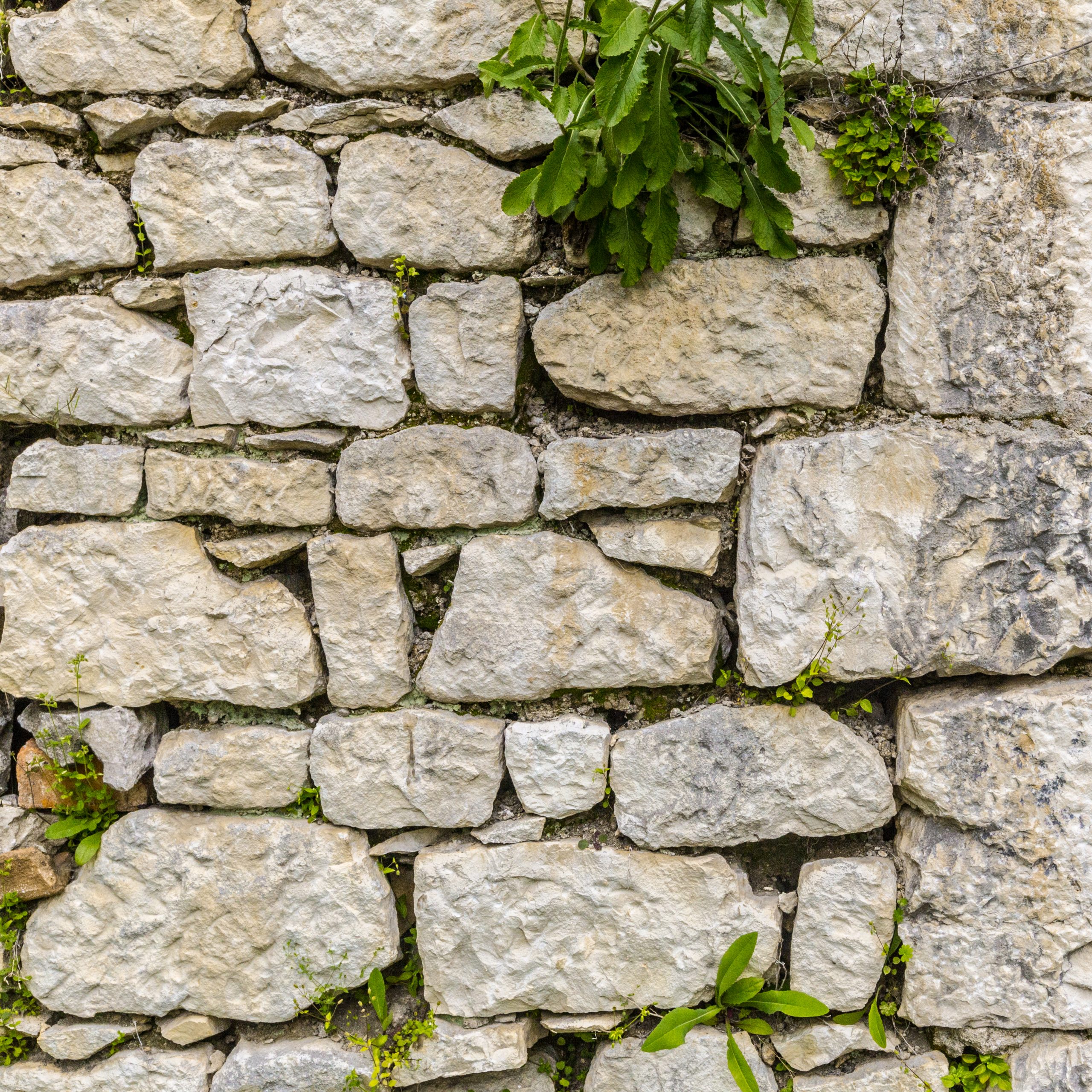 Old grungy gray stone wall texture